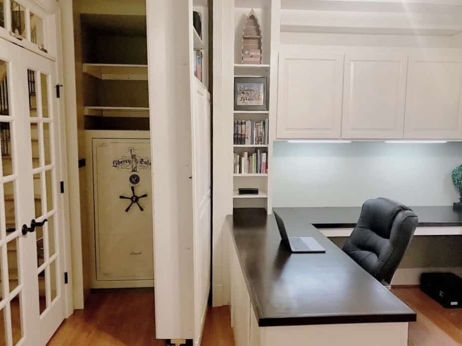 Hidden door and concealed room built into custom office cabinetry by Edgewood Cabinetry